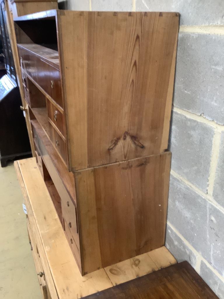 A pair of Continental cherrywood veneered pigeon holes, each 96 x 43cm